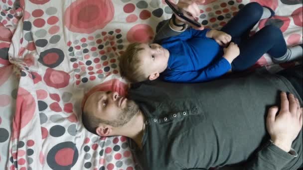 Father and baby child using smartphone — Stock Video