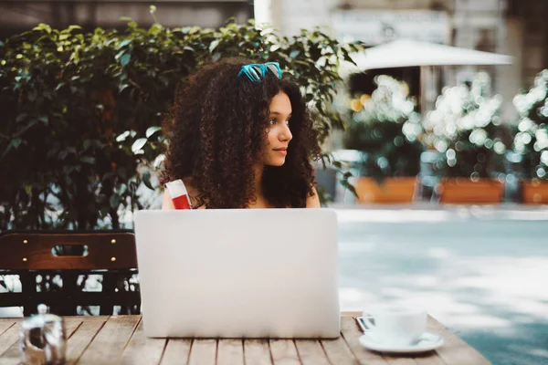 Dazzling Young Woman Curly Hair Wistfully Looking Aside While Sitting — Stock Photo, Image