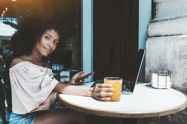 Afro girl in street bar with gadgets — Stock Photo, Image