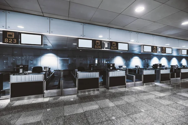 An empty check-in area in an airport