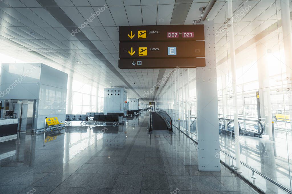 Airport departure hall with signpost