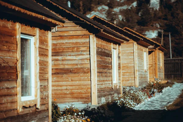 Wooden shacks in mountain settings