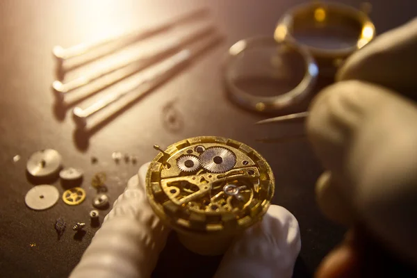 Watch maker is repairing a vintage automatic watch.