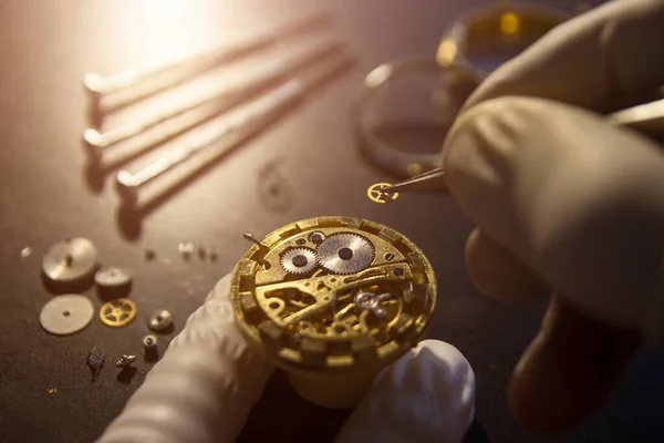 Watch maker is repairing a vintage automatic watch.