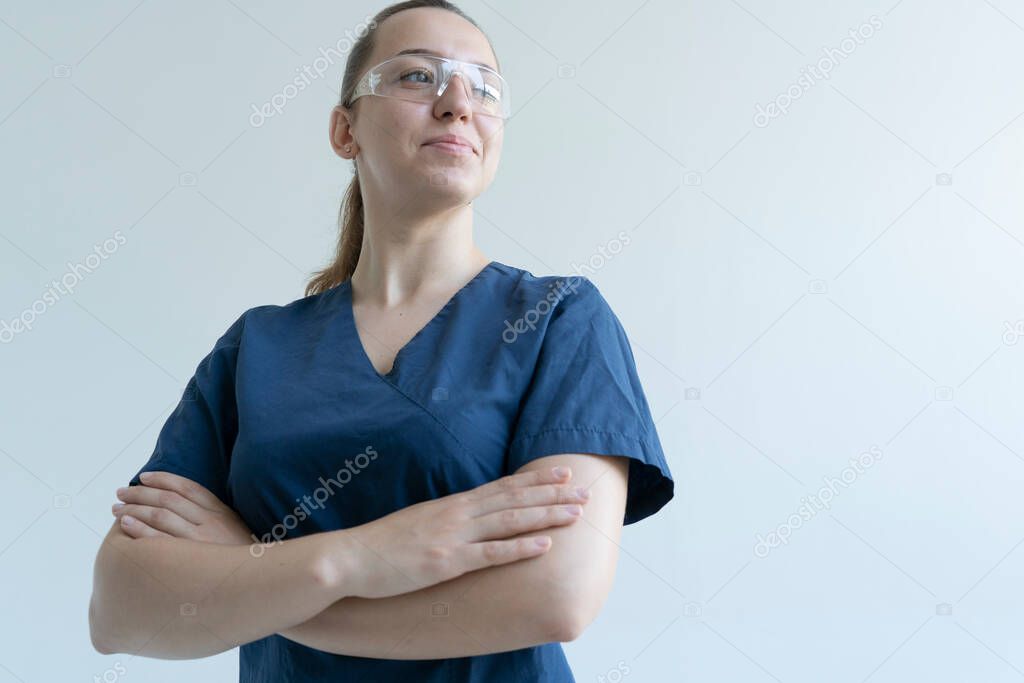 Smiling female doctor in a blue suit