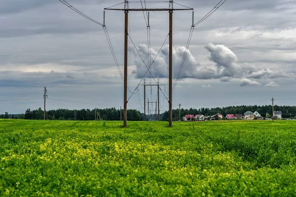 Power line against the background of dark clouds