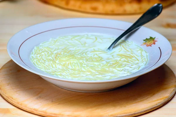 a plate of milk soup with vermicelli