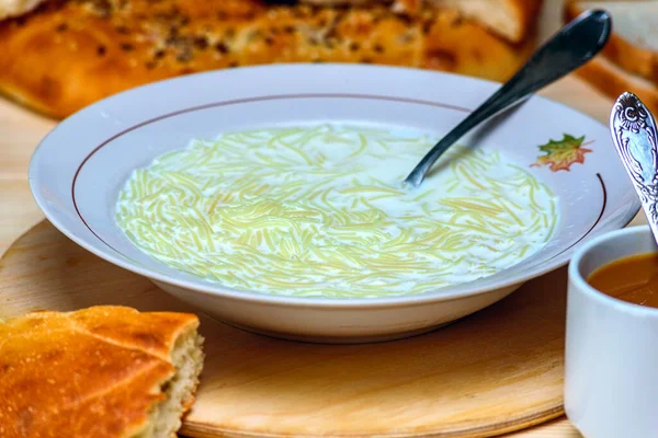 a plate of milk soup with vermicelli