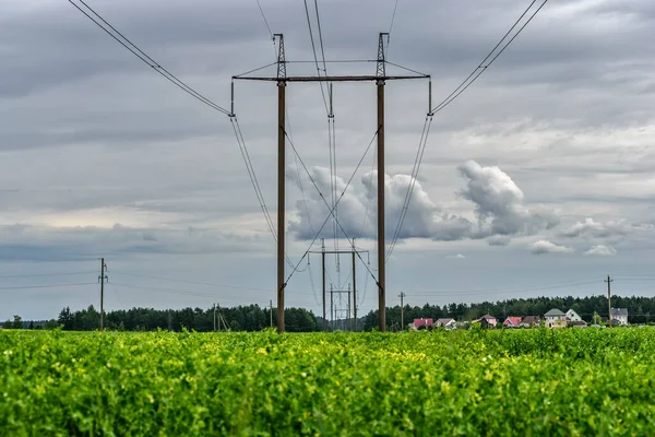 Power line against the background of dark clouds