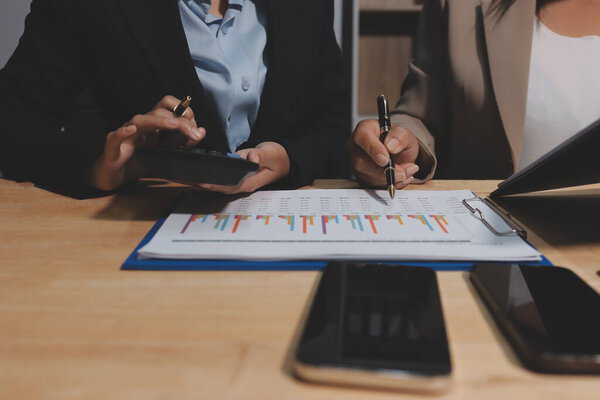 Accounting company provide finance and taxation planning for profitable cash flow, Auditor and accountant team working in office, analyze financial data and accounting record with calculator.Insight