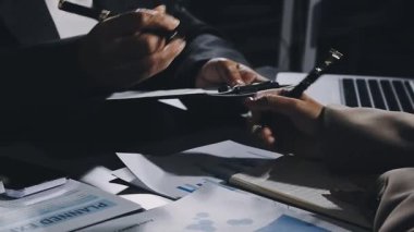 business team meeting with financial analysis.