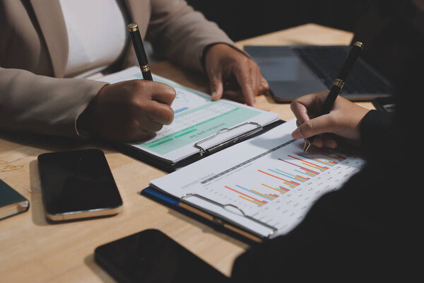 Accounting company provide finance and taxation planning for profitable cash flow, Auditor and accountant team working in office, analyze financial data and accounting record with calculator.Insight