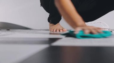 female foot on floor in the kitchen