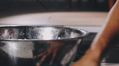 female hands knead dough