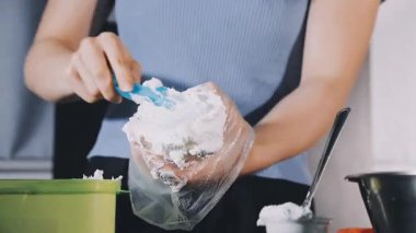 young woman cleaning hands with sponge and detergent.