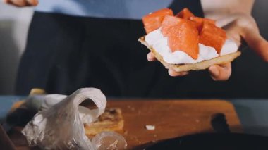 delicious sandwich in a plate with a knife and a fork