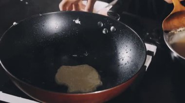 cooking pancakes in the stove.