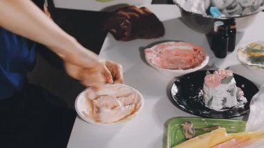 female hand preparing sushi on the kitchen