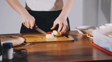 cooking process on a table, woman preparing food at home