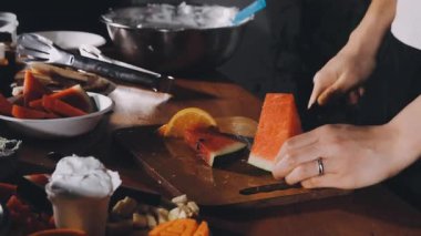 chef preparing fresh vegetables on kitchen table