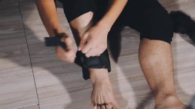 man in black leather with a black belt