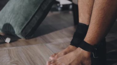 legs and legs of man in black socks on sofa