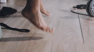 close up of man doing foot exercises in gym