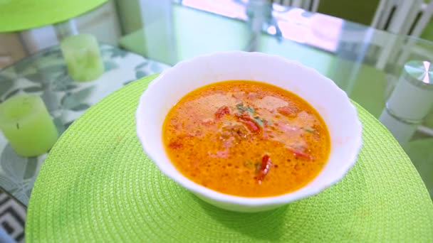 Red vegetable soup borsch of beets with sour cream on a green table. Ukrainian food. Full HD. — Stock Footage Red Vegetable Soup Borsch Beets Sour Cream Green Table Ukrainian Stock Footage