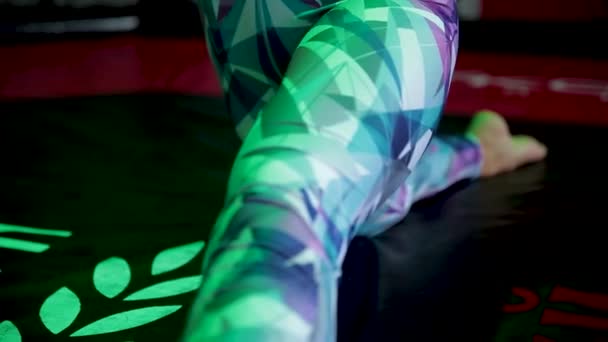 Young woman sits on the twine in the gym. — Stock Footage Young woman sits on the twine in the gym. Royalty Free Stock Footage