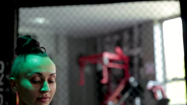 Young woman sits on the twine in the gym. — Stock Footage Young woman sits on the twine in the gym. Video Clip