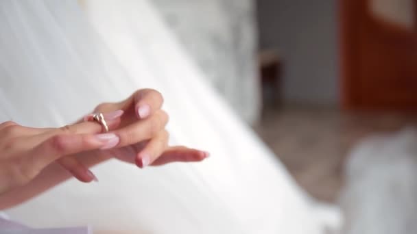 Beautiful young woman putting ring on her finger. — Stock Video