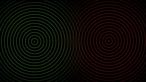 Abstrakte rote und grüne Kreise schlagen auf schwarzem Hintergrund — Stockvideo