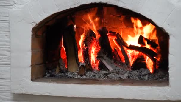 Wood burning in a cozy fireplace at home — Stock Video