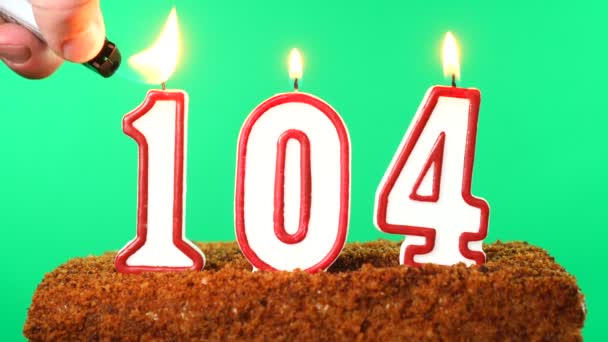 Cake with the number 104 lighted candle. Chroma key. Green Screen. Isolated — Stock Video