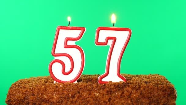 Cake with the number 57 lighted candle. Chroma key. Green Screen. Isolated — Stock Video