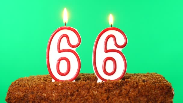 Cake with the number 66 lighted candle. Chroma key. Green Screen. Isolated — Stock Video