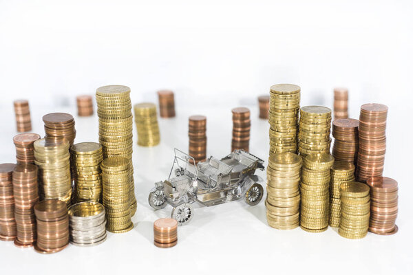 Abstract photo of car price rising. Car model isolated on white background with a lot of euro coins.
