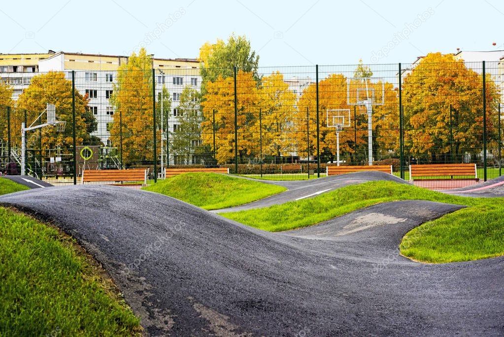 Bicycle track road. Located in city playground.