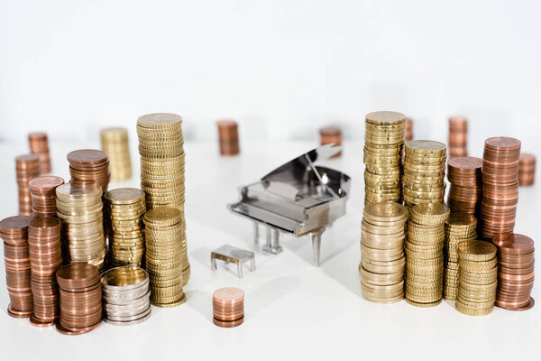 Abstract photo of music. Small metal piano with notes book. Piano Jazz music.
