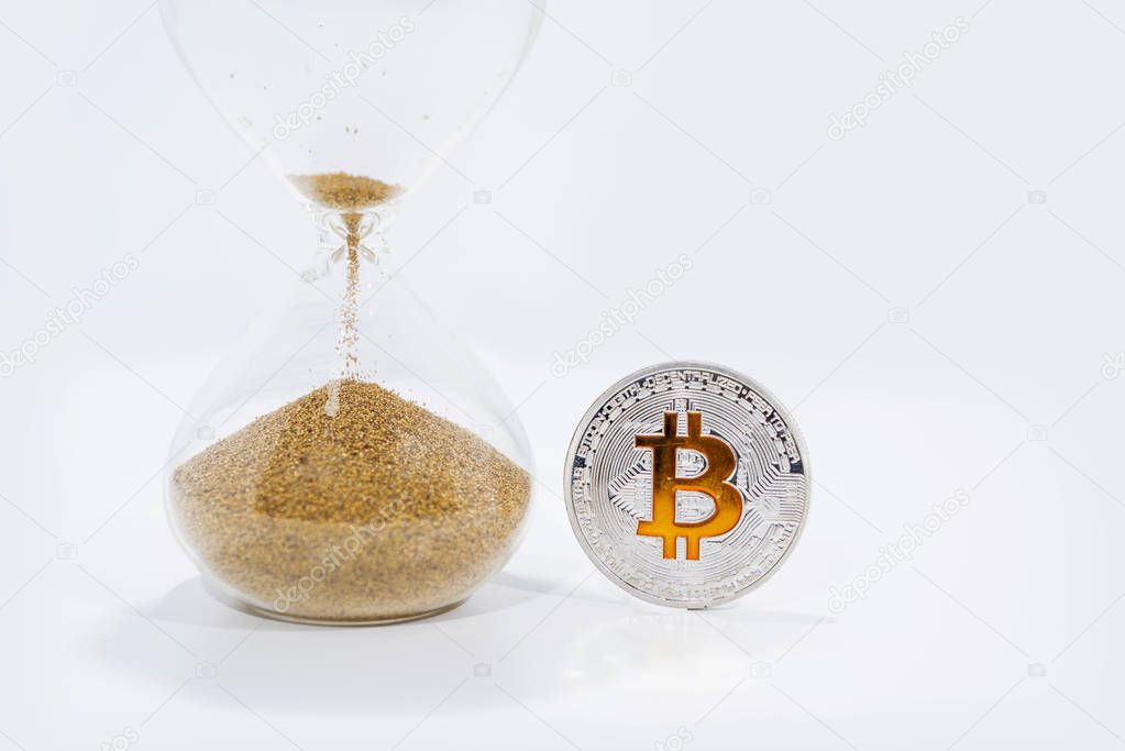 Some big crypto currency coins with sand clock.