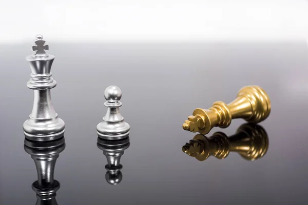 Abstract composition of chess figures. Isolated chess on black mirror. — Stock Photo, Image