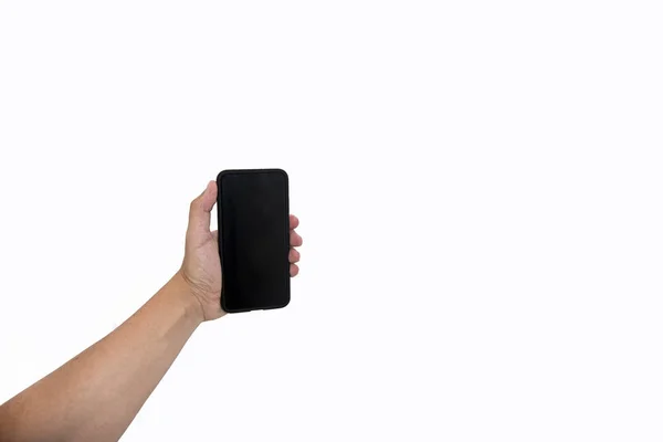 Mužíček držící černý mobil s černou obrazovkou na izolovaném pozadí. — Stock fotografie