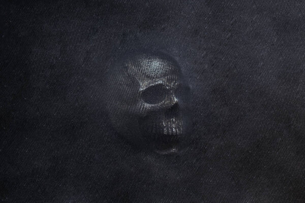 Human Skull on black textured background. Abstract photo.