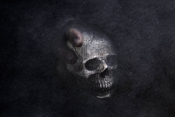 Human Skull on black textured background. Abstract photo.