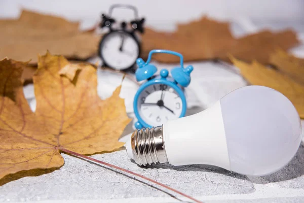 Money for heating bills with black heater on white background. Autumn season.