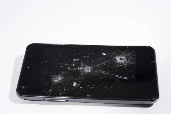 Abstraktní fotografie poškozeného nebo poškozeného smartphone. — Stock fotografie