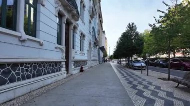 Lisbon summer POV travel walking photo with tiled houses European lifestyle tourism