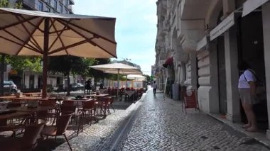 Summer Lisbon POV photo of cobblestone streets colorful facades historic architecture tourism