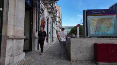 Lisbon Portugal summer POV walking city architecture cobblestones tiled walls lifestyle