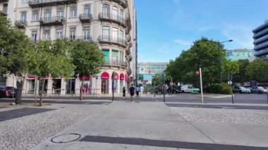 Summer Lisbon POV photo with bright houses historic streets and European travel vibes